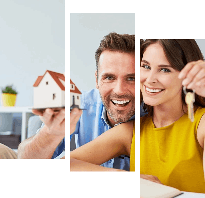 A couple holding keys to their new home.