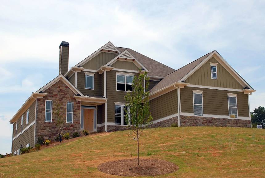 A large house sitting on top of a hill.