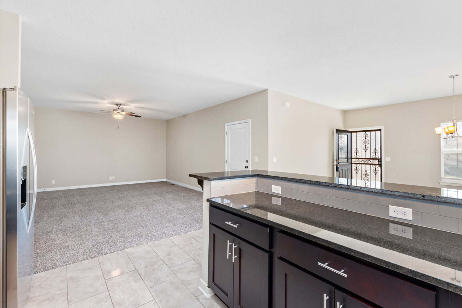 A kitchen with a large open floor plan.